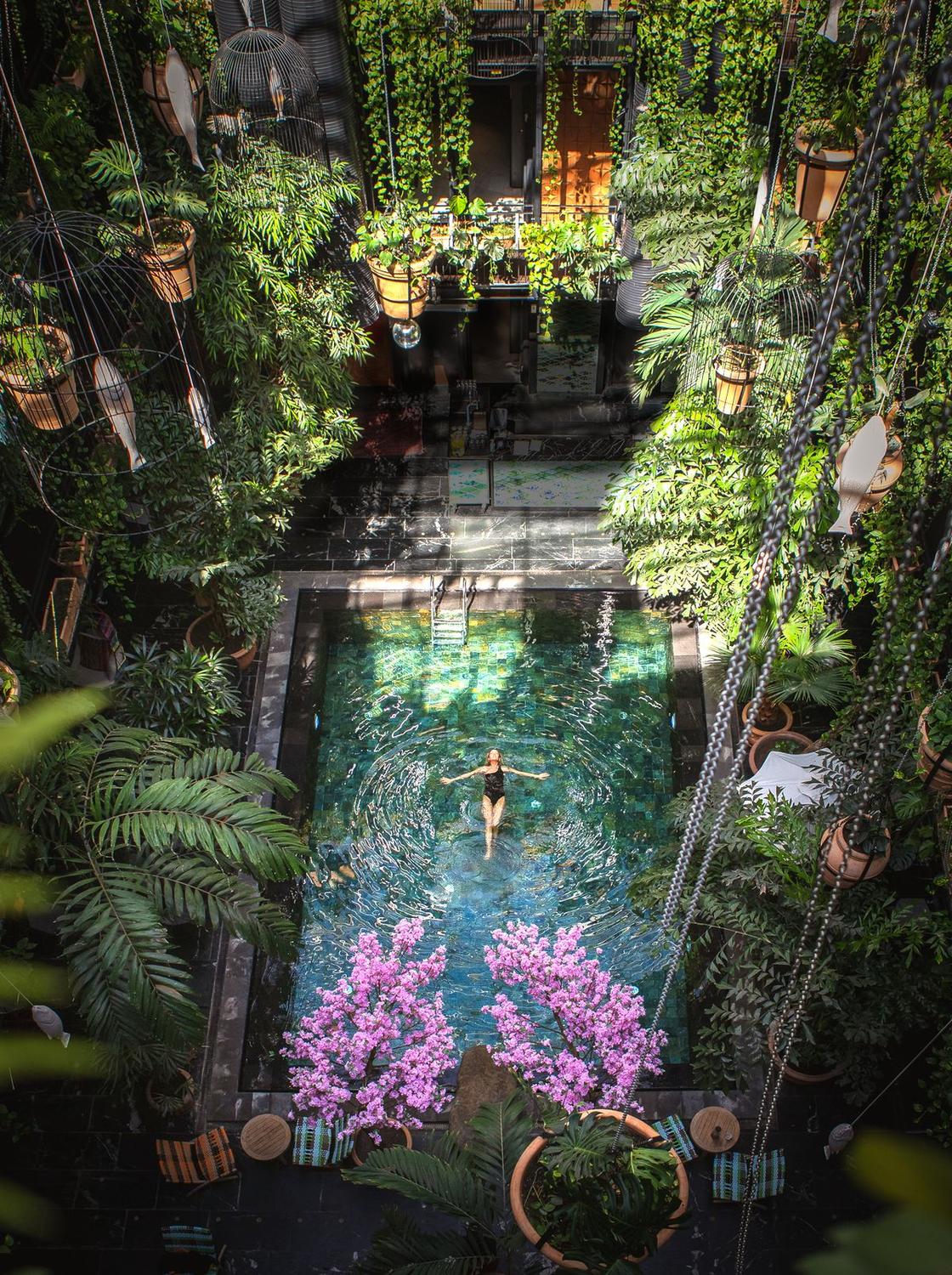 Manon les Suites — the indoor jungle pool ringed in tropical greenery