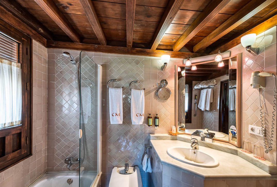 Casa Morisca Hotel Granada — 14-room restored 15th-century Moorish house in Albaicín UNESCO quarter with direct Alhambra sightlines