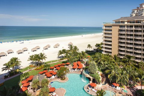 Best Western Plus Marco Island — modern mid-island hotel with palm-lined pool deck, Florida