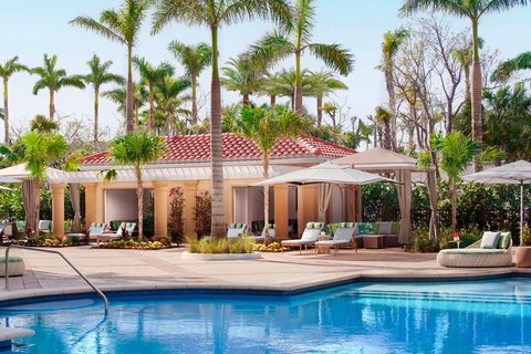 The Ritz-Carlton, Naples — Forbes Five-Star beachfront resort on Vanderbilt Beach, Naples Florida, with palms and Gulf of Mexico view