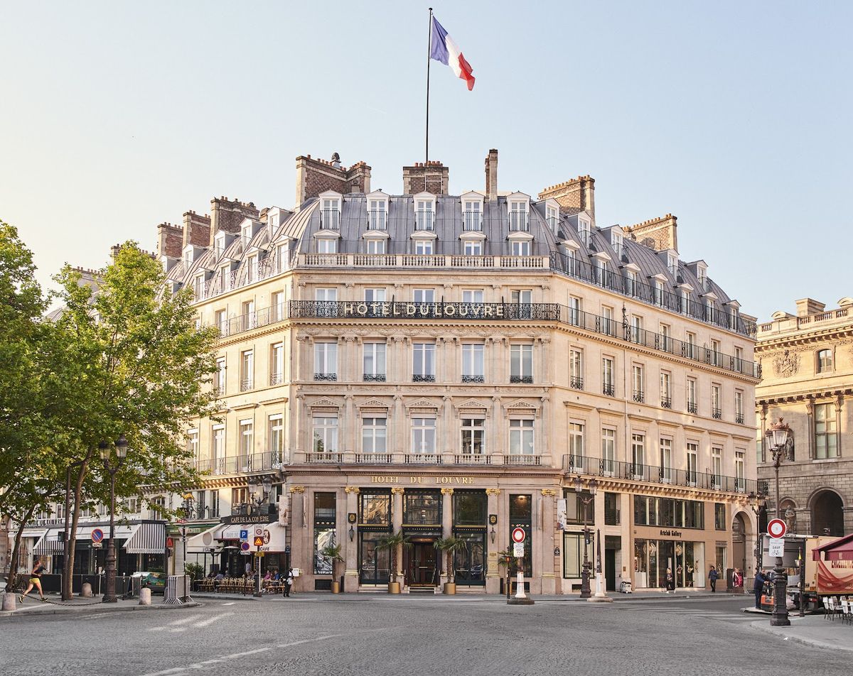 Hôtel du Louvre Paris room — classic Haussmann proportions, period mouldings, views over Place André Malraux
