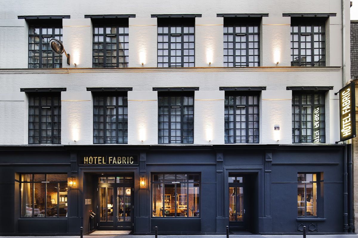 Hôtel Fabric Paris room — exposed brick, industrial bones, contemporary design in former textile factory, 11th arrondissement