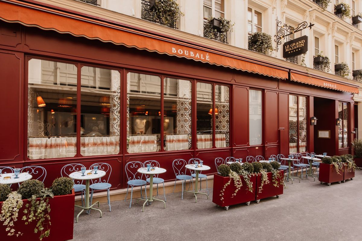 Le Grand Mazarin Paris room — warm textiles, natural materials, Marais rooftop views in five-star 4th arrondissement hotel