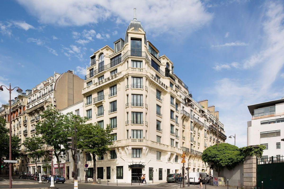 Terrass' Hotel Montmartre Paris — artist-lodge-inspired room with warm materials and south-facing Eiffel Tower views