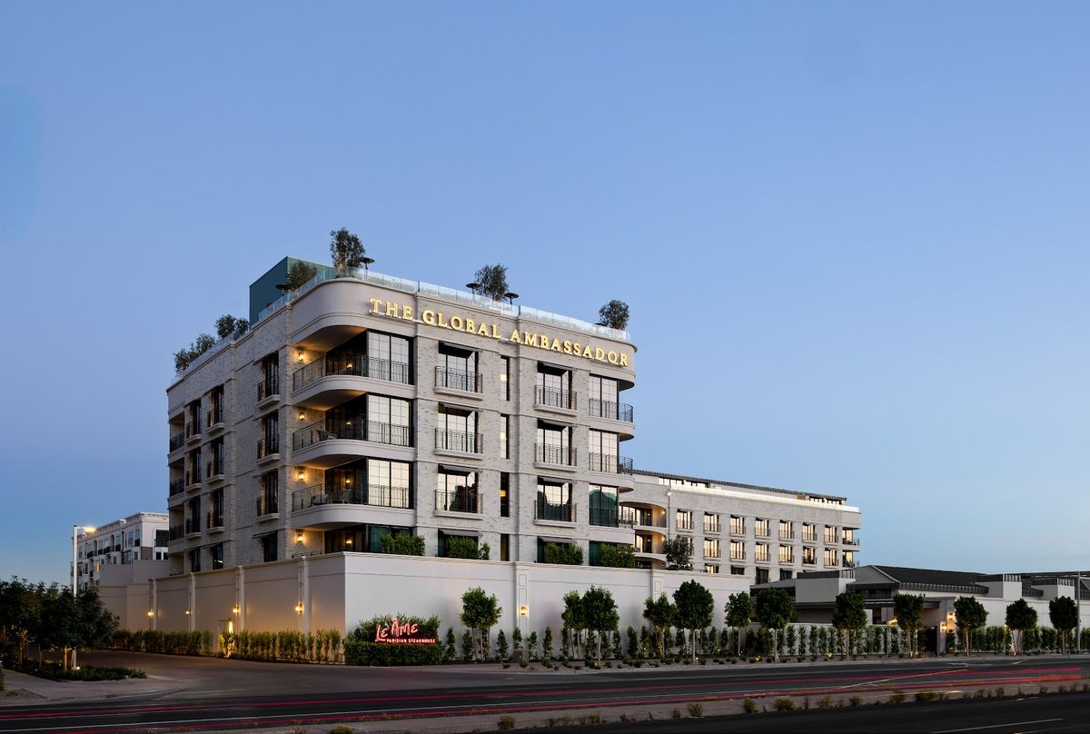 The Global Ambassador — boutique five-star hotel on Camelback Road in Phoenix Camelback Corridor at dusk