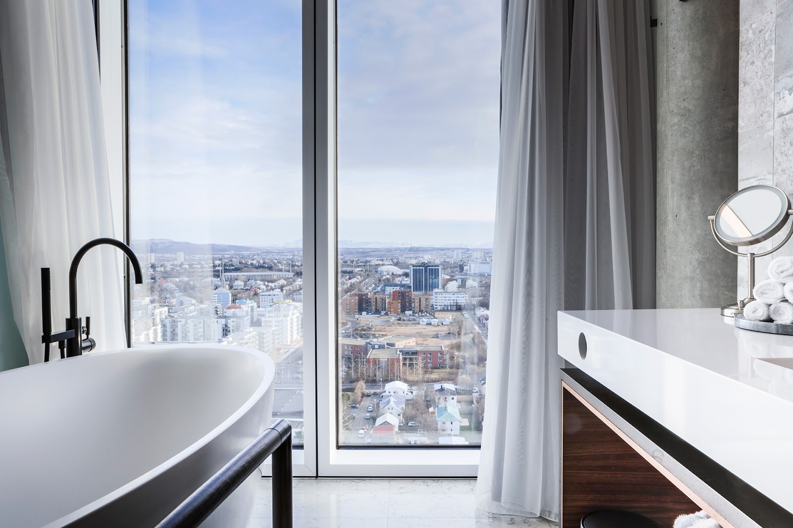 Tower Suites Reykjavik — 20-suite penthouse-floor boutique on Höfðatorg with 360° Reykjavik panoramic sightlines