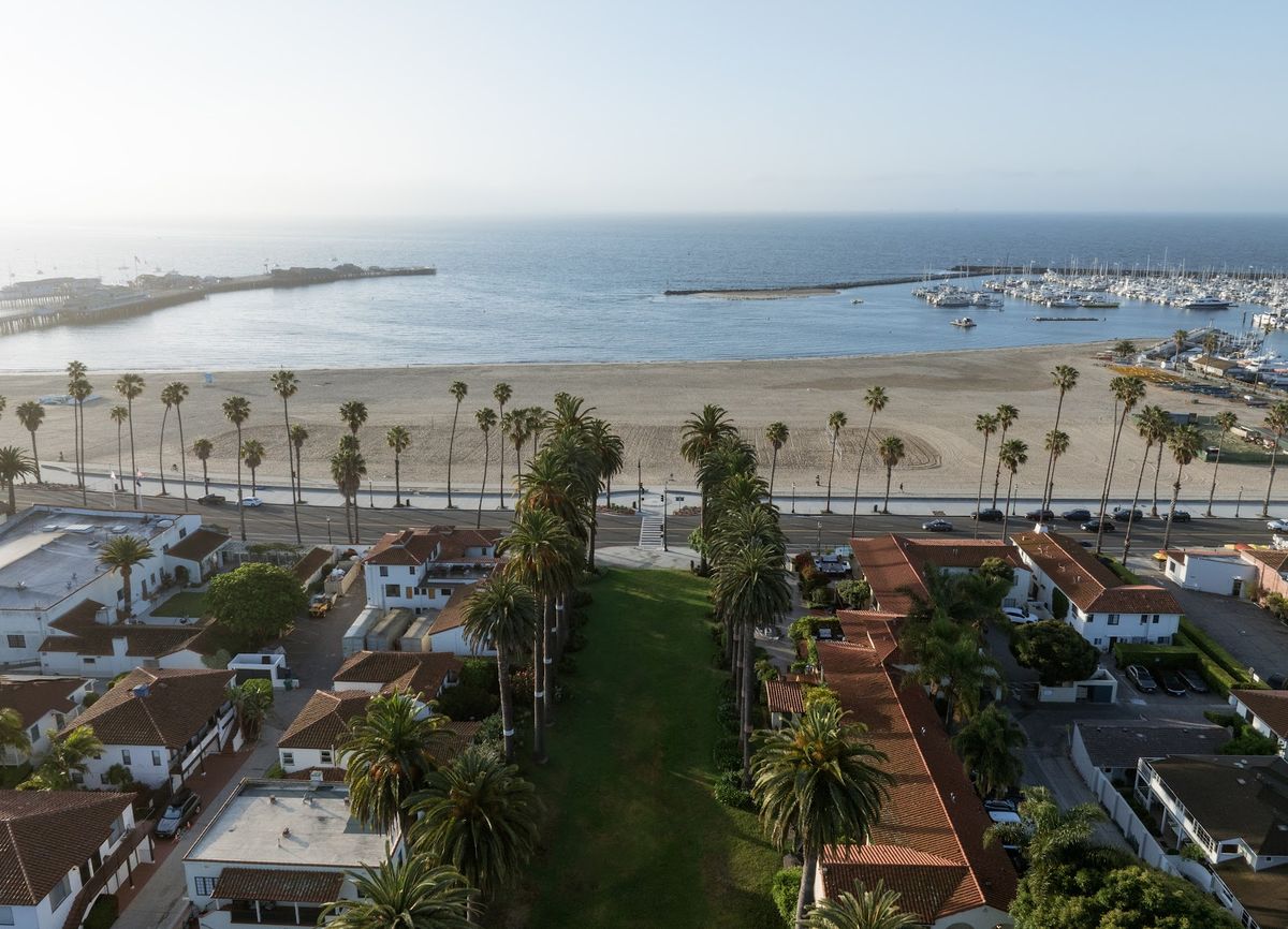 Hotel Milo Santa Barbara — 1928 Mediterranean Revival hotel on West Cabrillo Boulevard, palm-lined waterfront facade