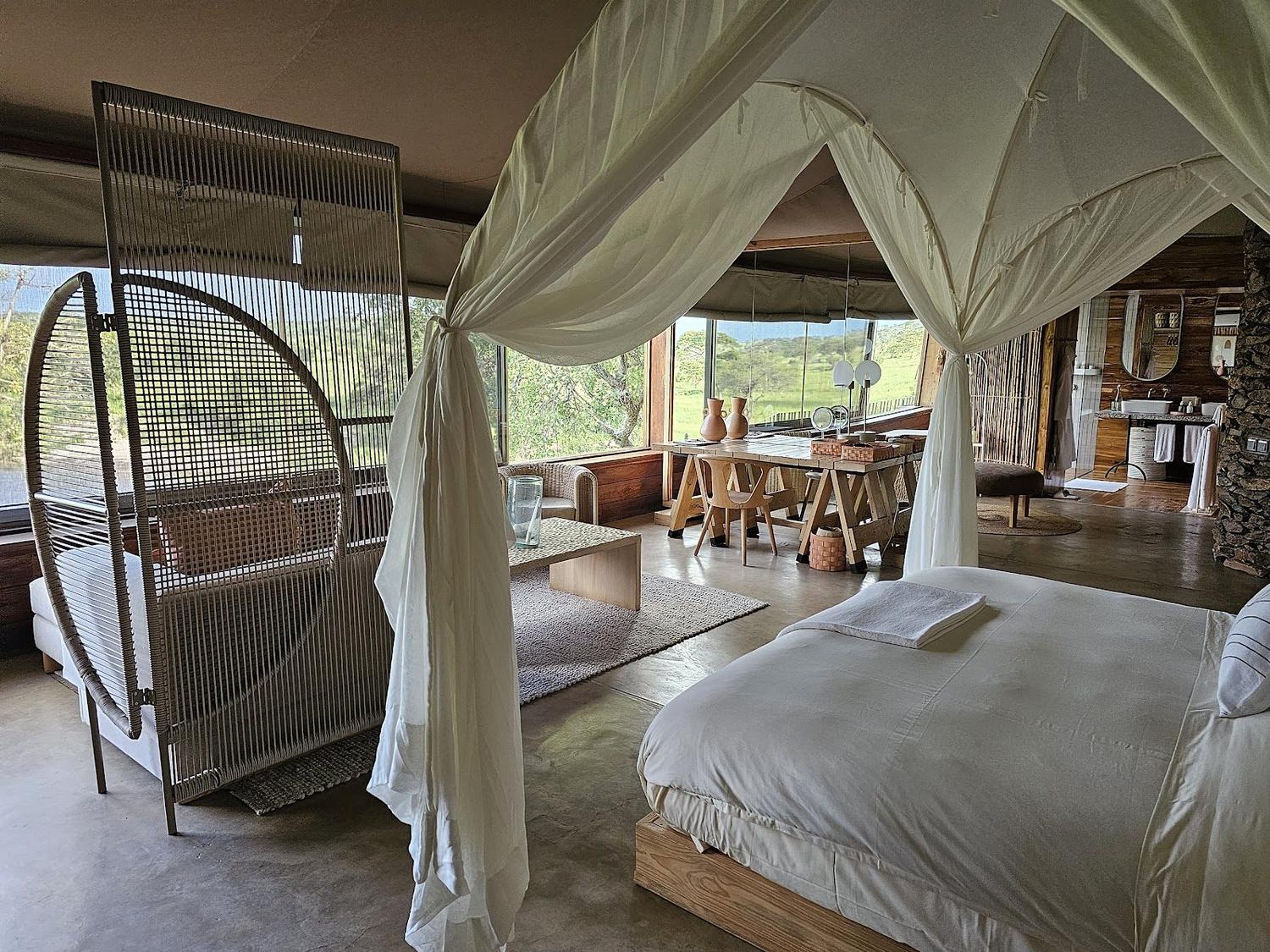 Singita Faru Faru Lodge Serengeti — 9 raised tented suites on Grumeti River frontage with contemporary-Africana design