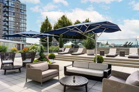 JW Marriott Parq Vancouver — five-star hotel tower at False Creek with BC Place stadium nearby